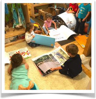Children reading books on the floor