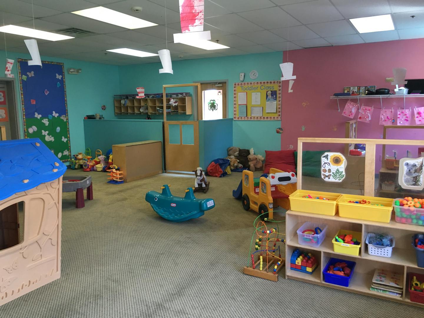 Playroom with various toys and play structures