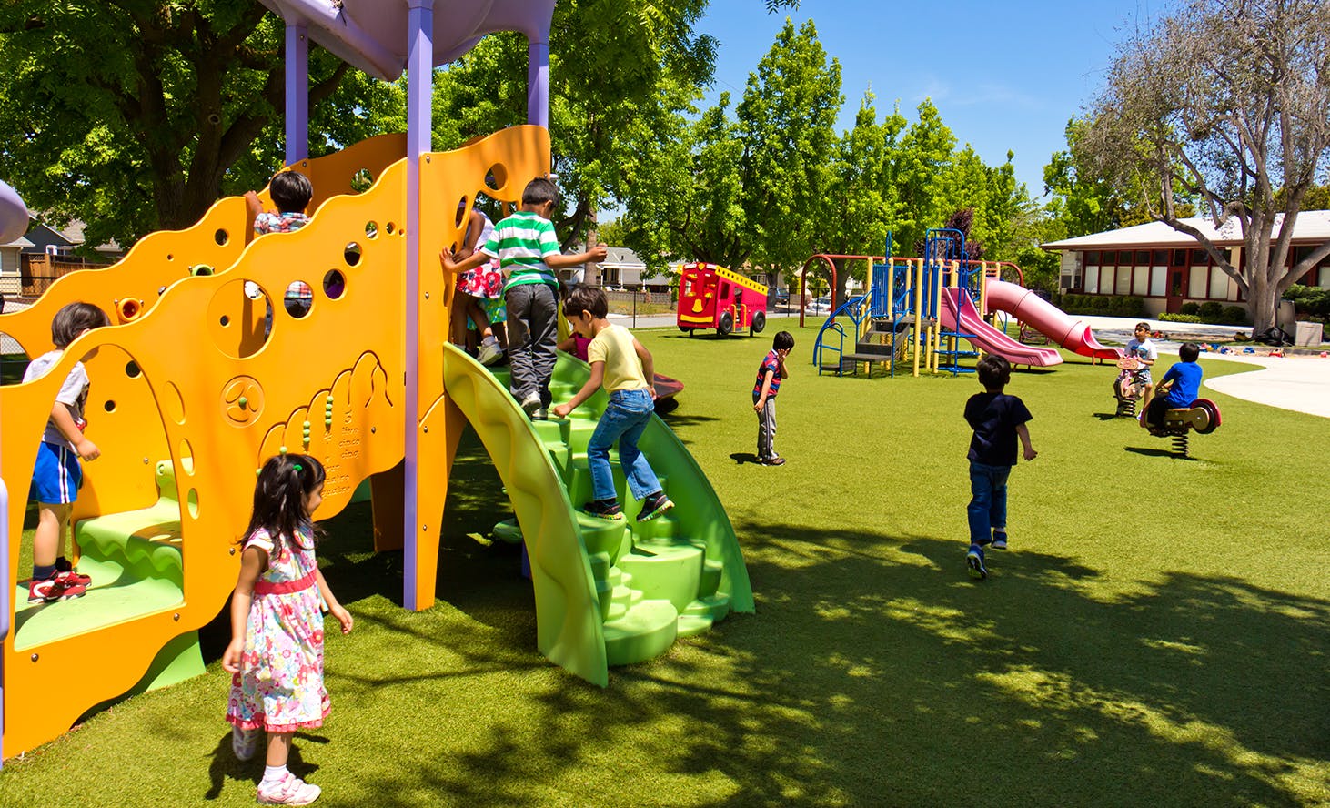 Children playing on a playground structure