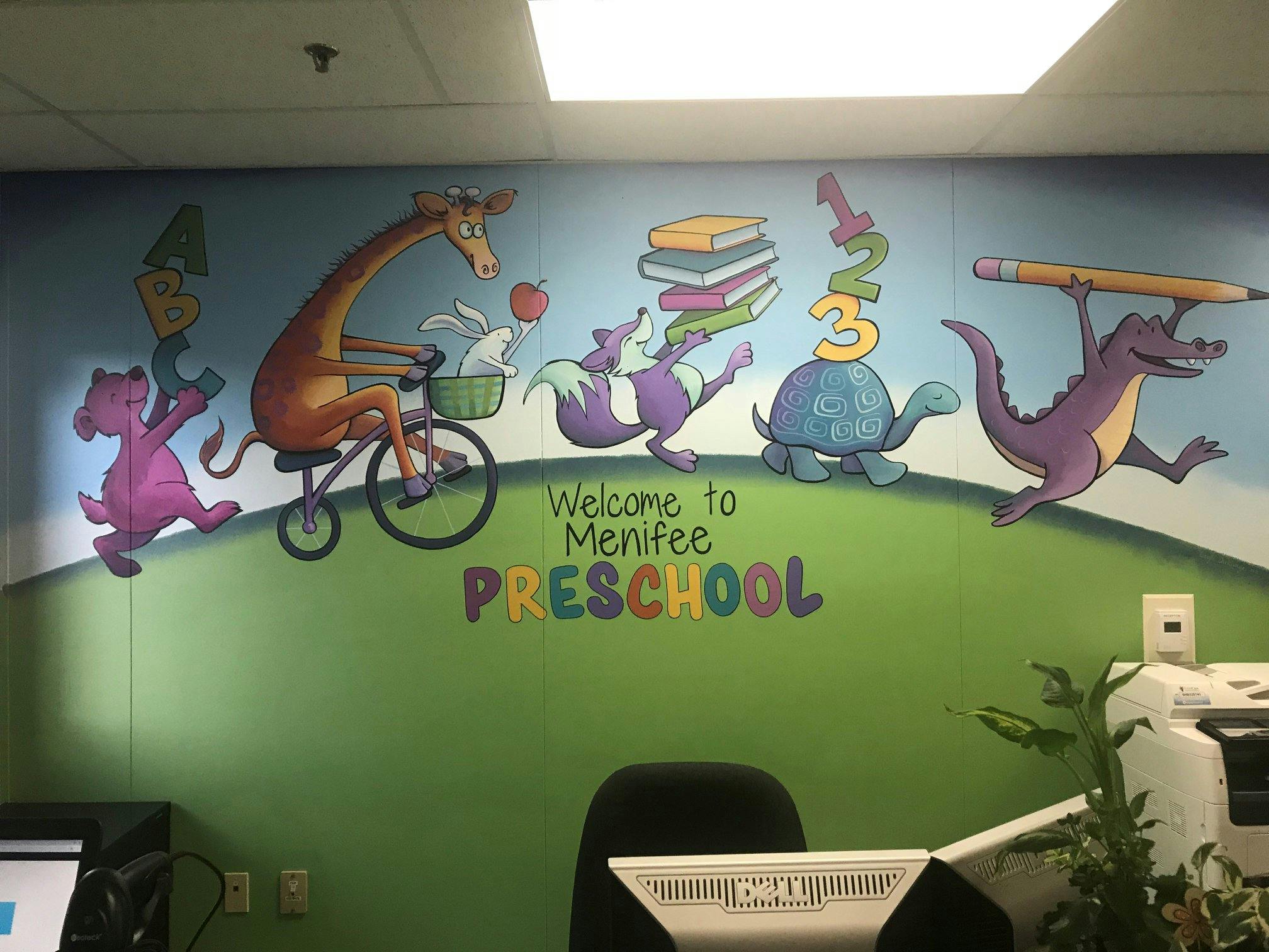 Mural of cartoon animals with text "Welcome to Menifee Preschool"