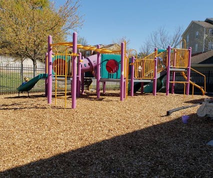 Playground with slides, tunnels, and climbing structures
