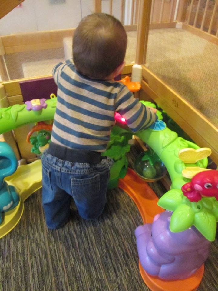 Child playing with a colorful toy