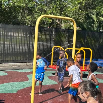 Children playing in a splash pad area