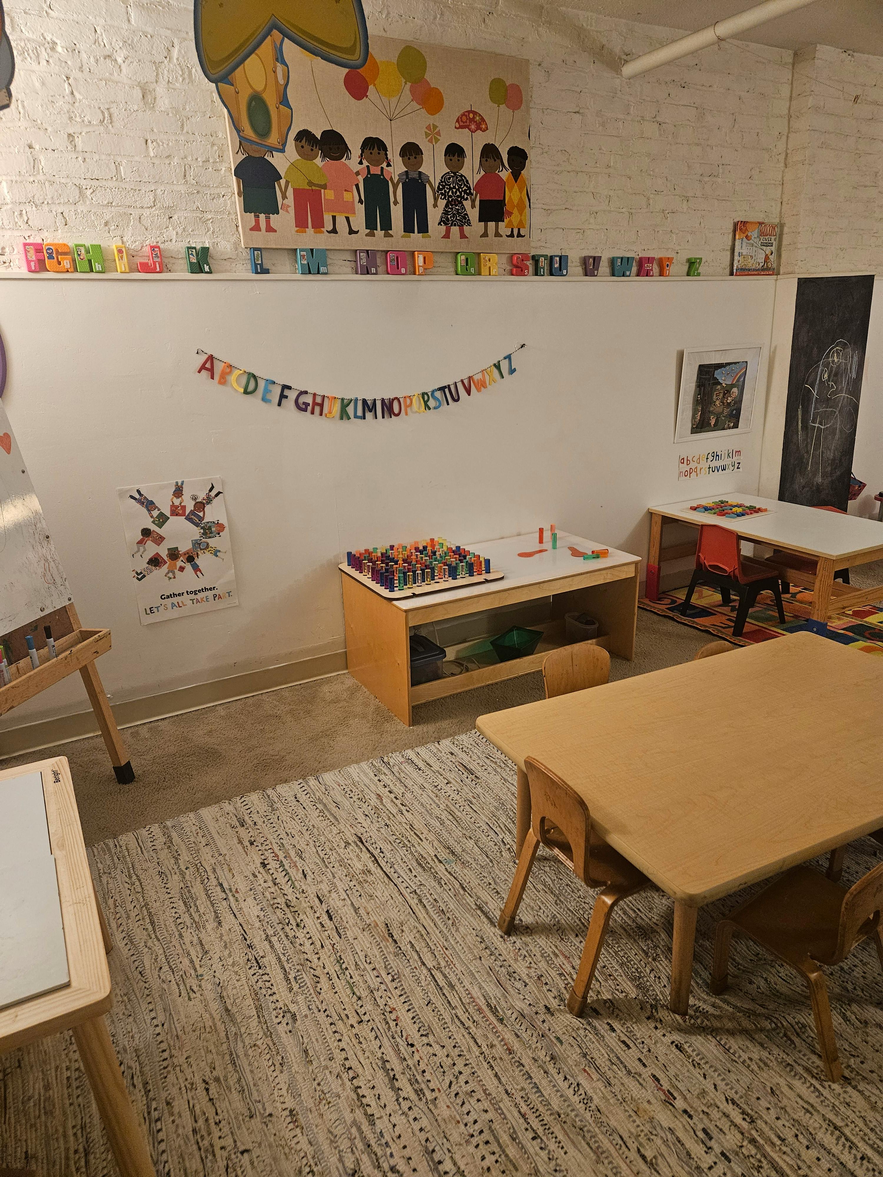Classroom furniture and educational wall decorations in a learning space