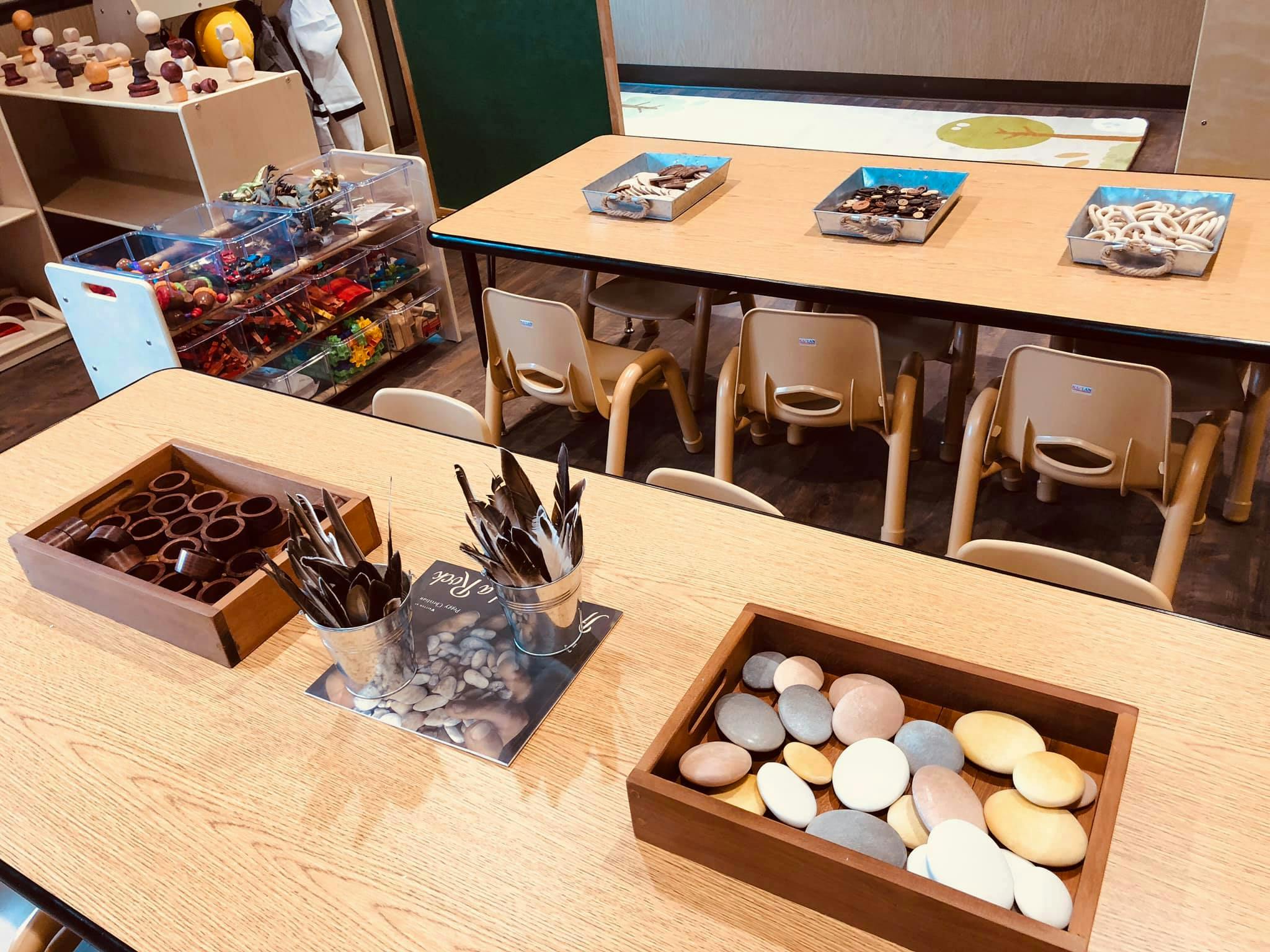 Classroom with tables, chairs, and various craft supplies