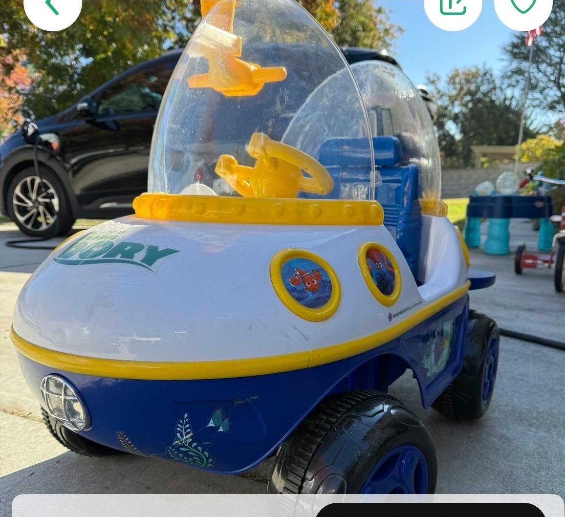 Child's toy car that looks like a submarine, with 'DORY' on the front