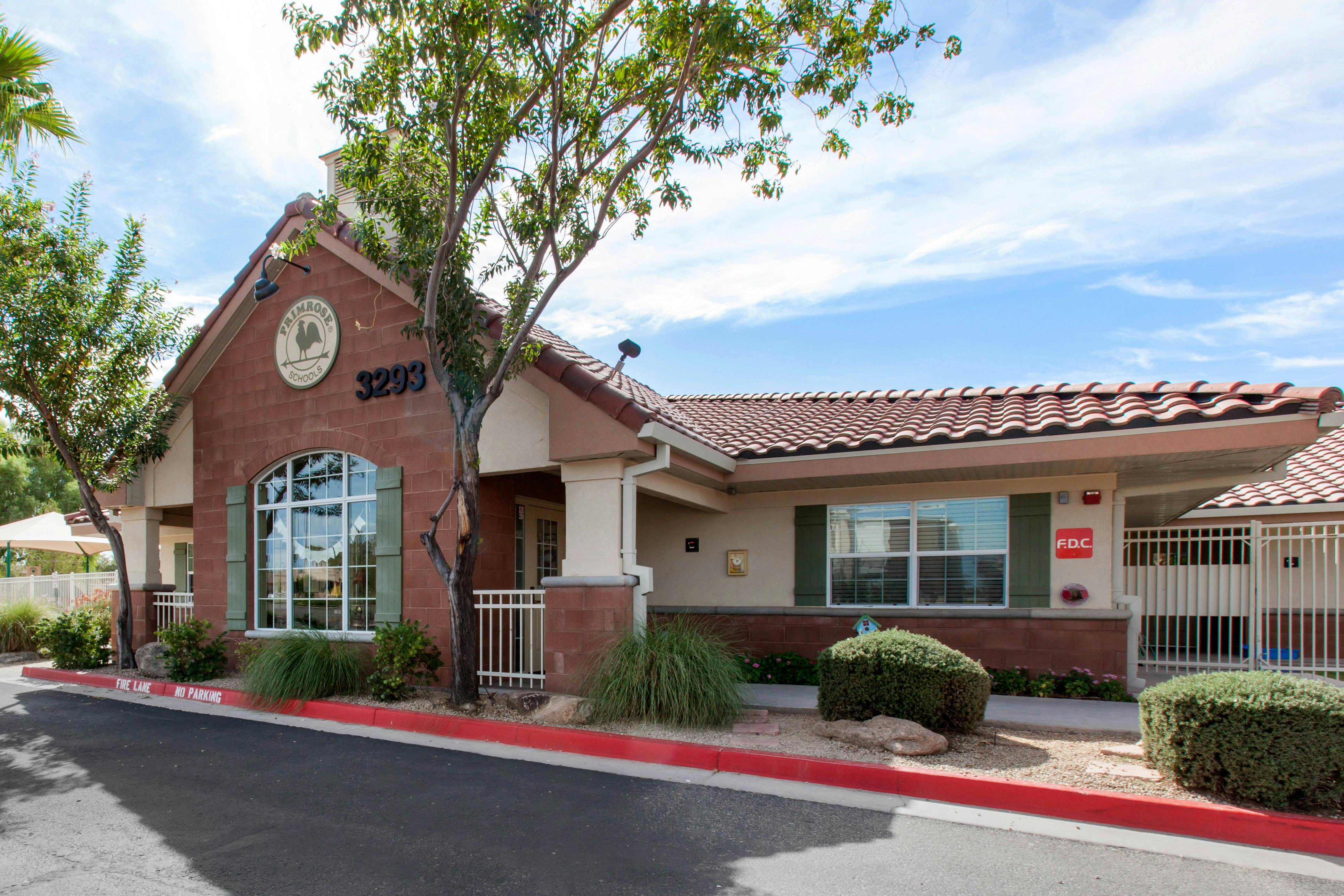 Exterior of Primrose Schools building with red tile roof, stucco, and red brick