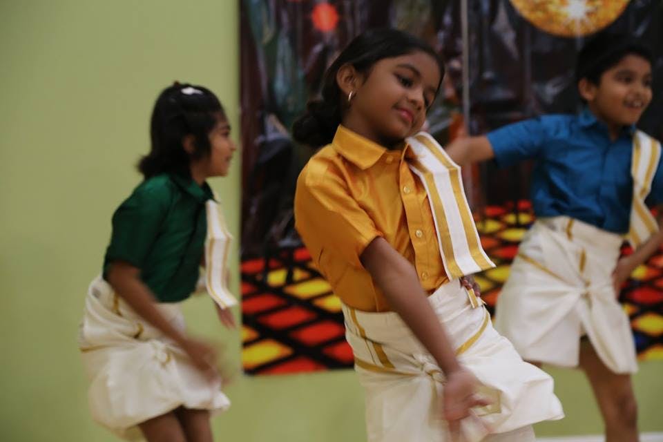 Children in traditional clothing dancing