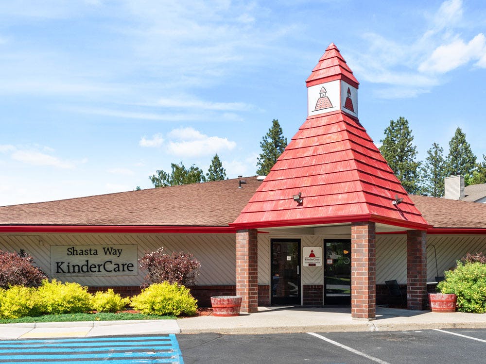 Shasta Way KinderCare building entrance with red roof and steeple