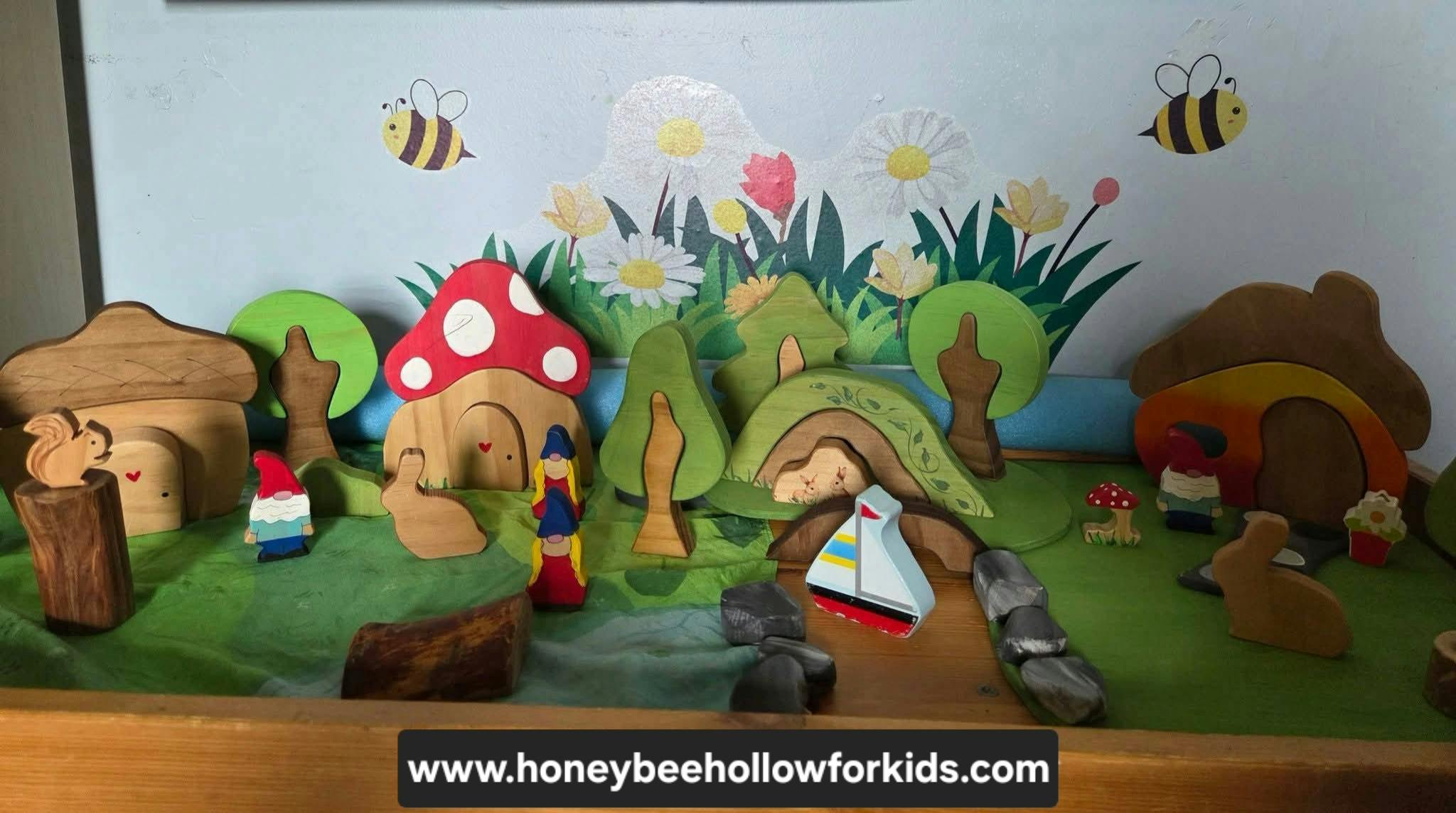 Wooden toy forest landscape with mushroom houses and gnome figures