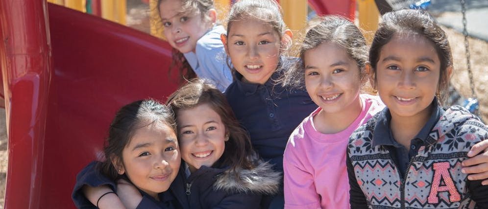 Group of children on a playground slide