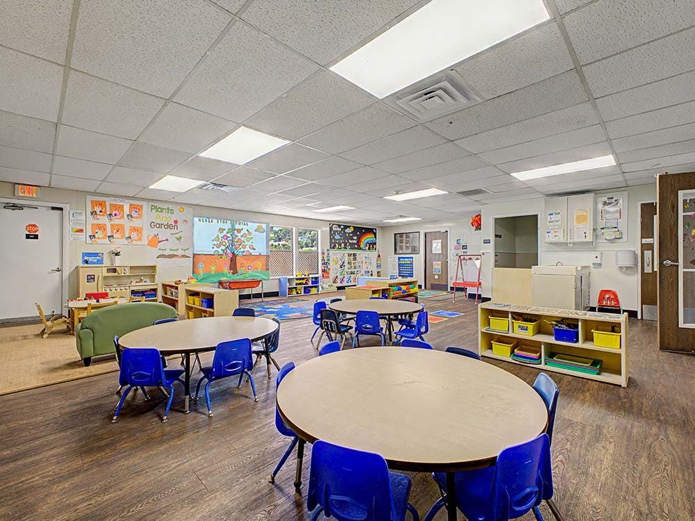 Classroom with child-sized tables and chairs