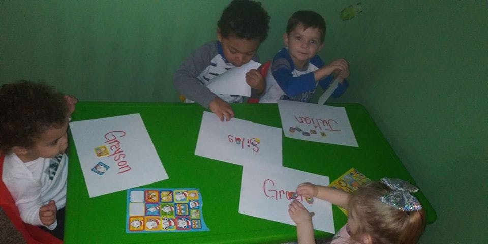 Children drawing at a table