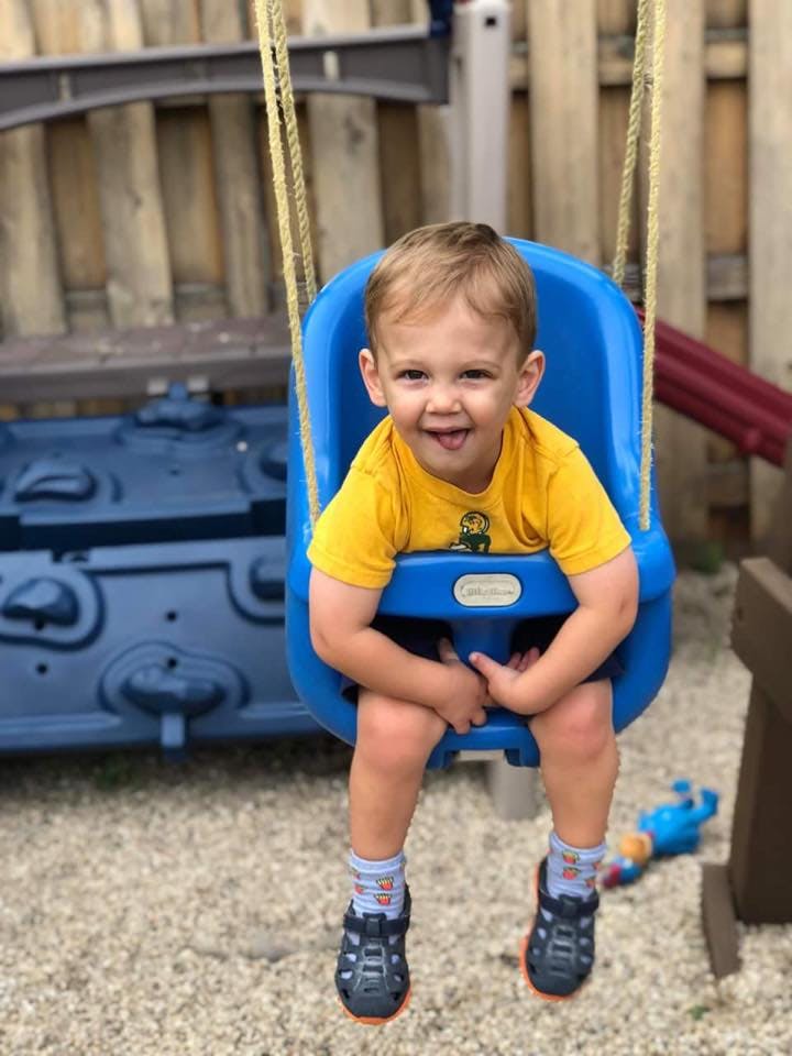 Child in a blue swing