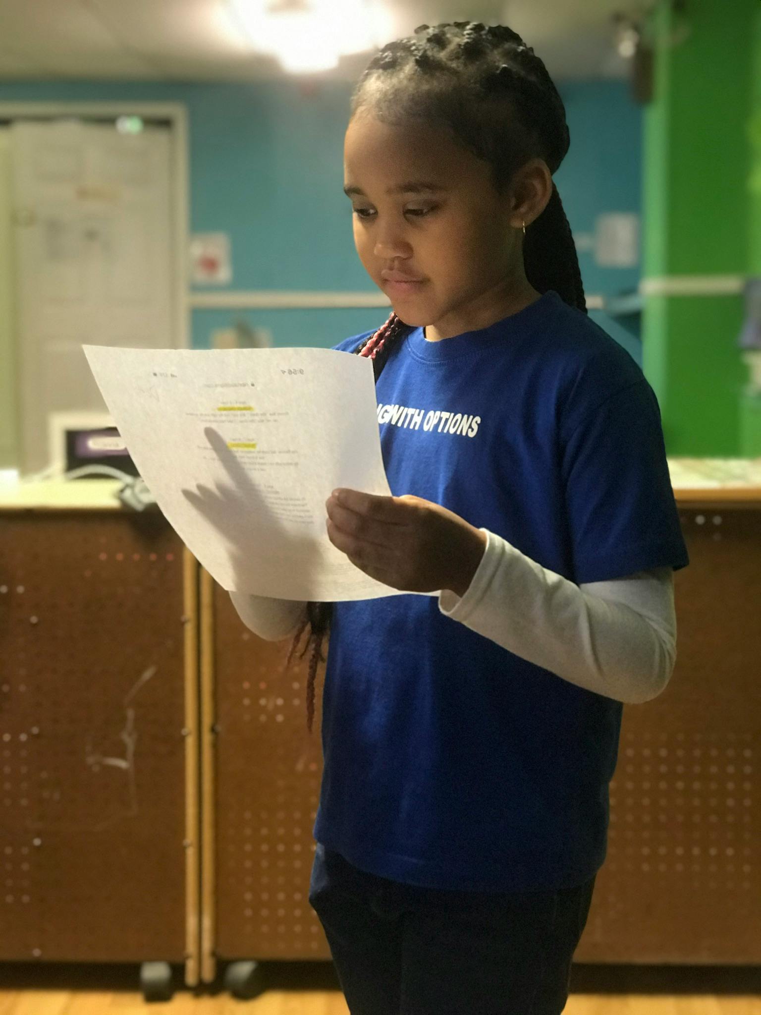 Child reading a document