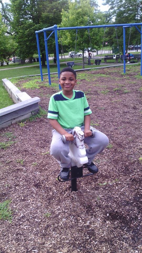 Child on a spring rider in a playground