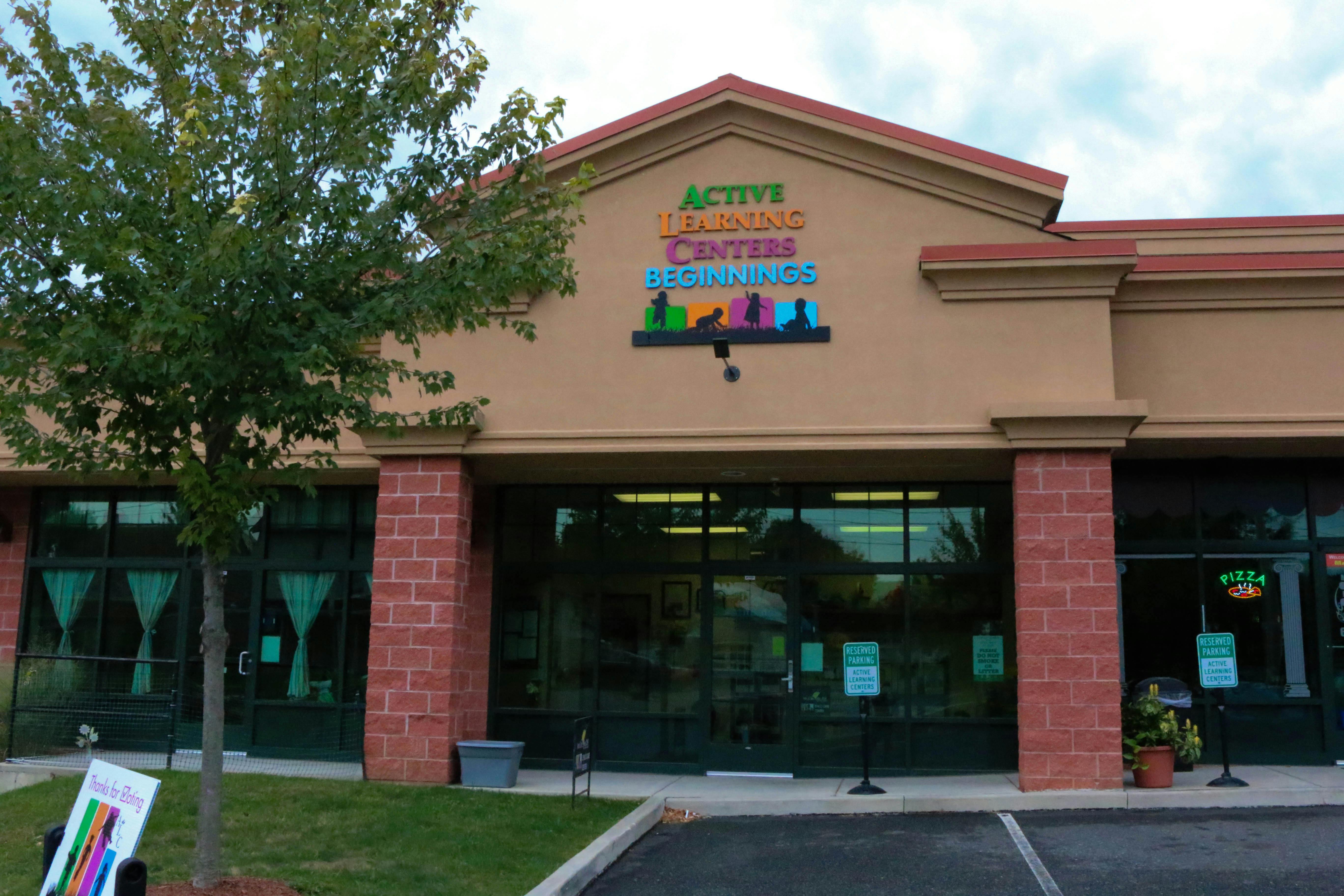 Building exterior with sign reading "Active Learning Centers"