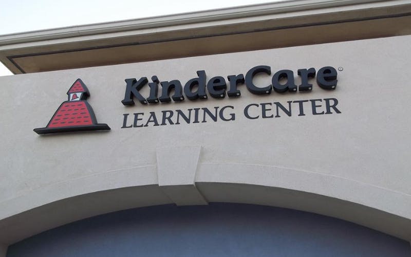 KinderCare Learning Center sign with building-shaped logo