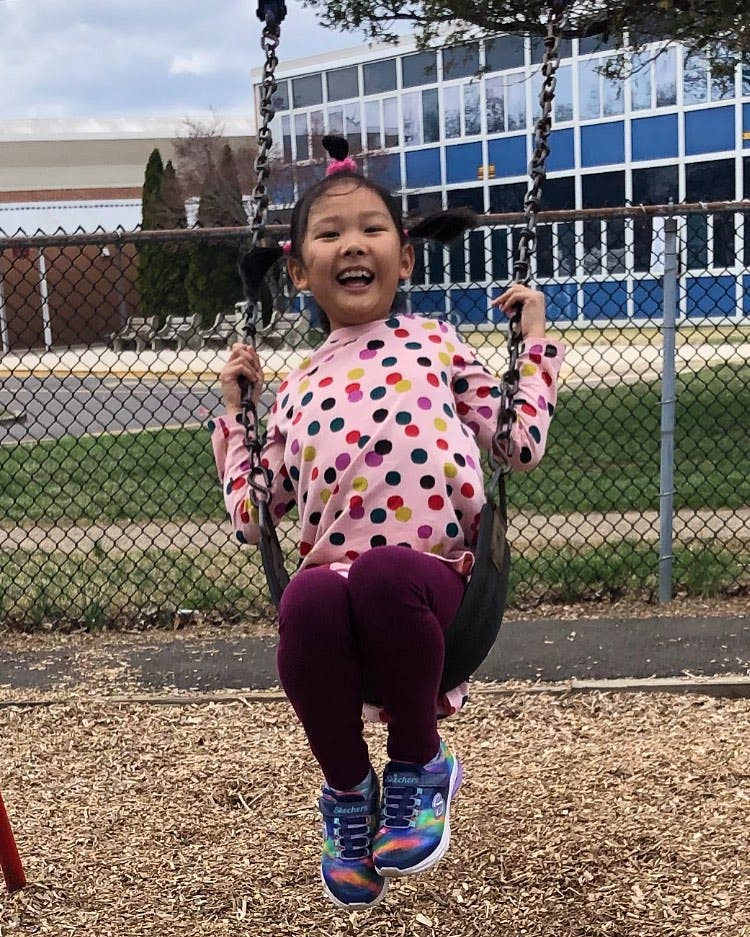 Child on a swing at a playground