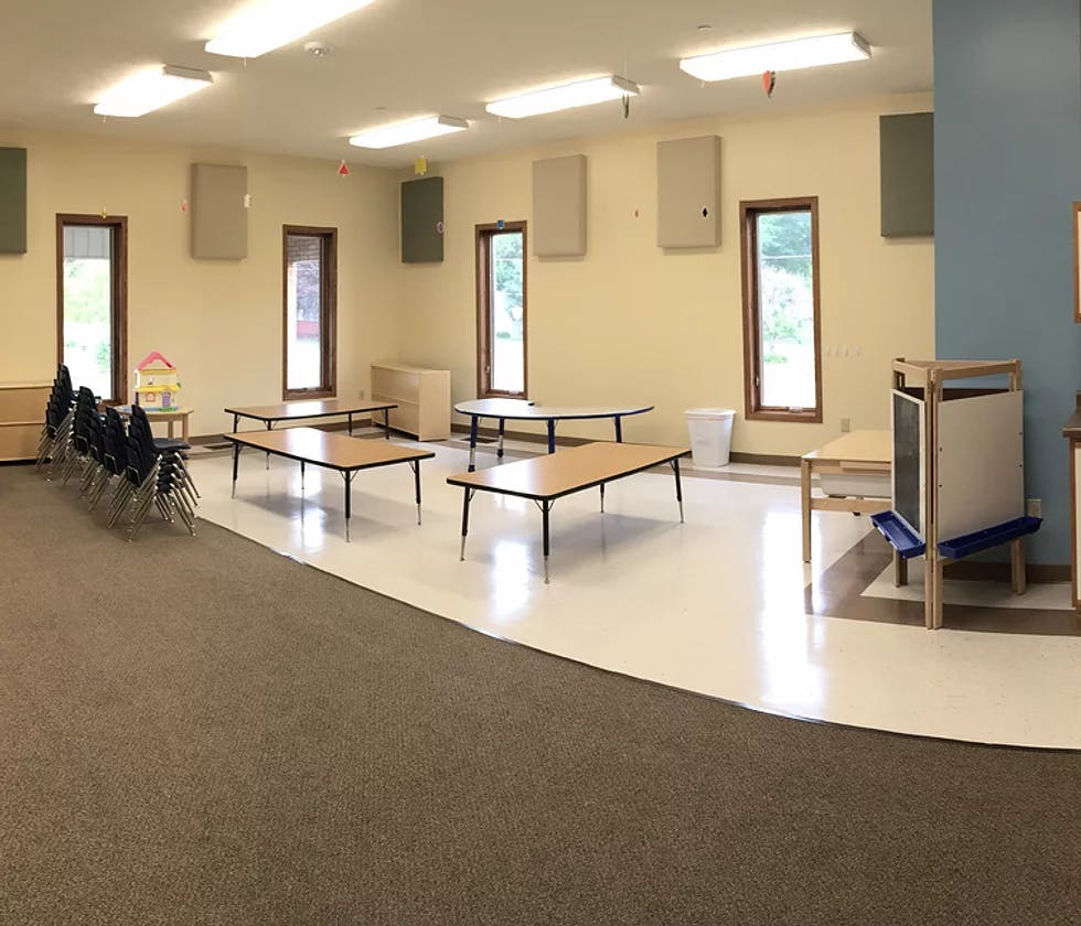Empty room with tables and chairs