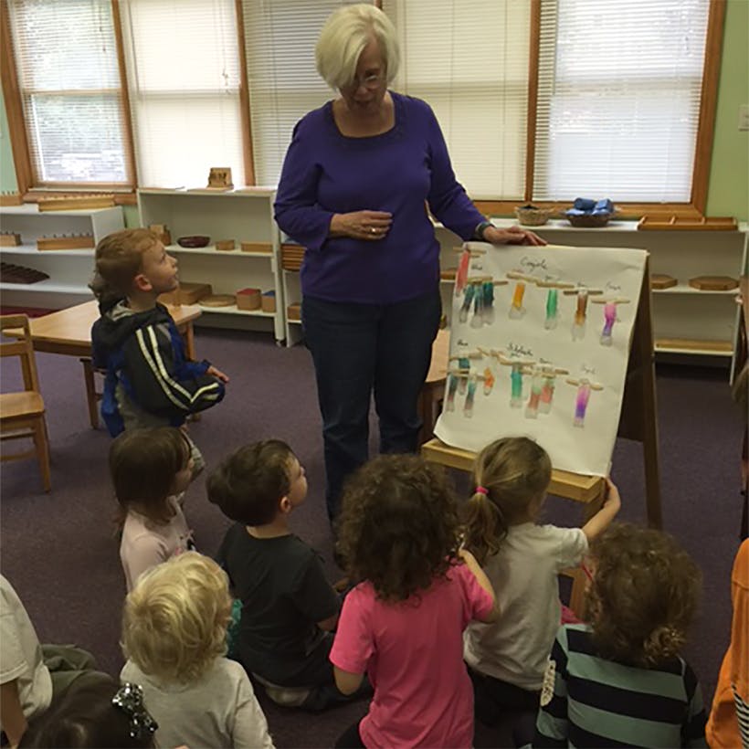 Person teaching children in a classroom