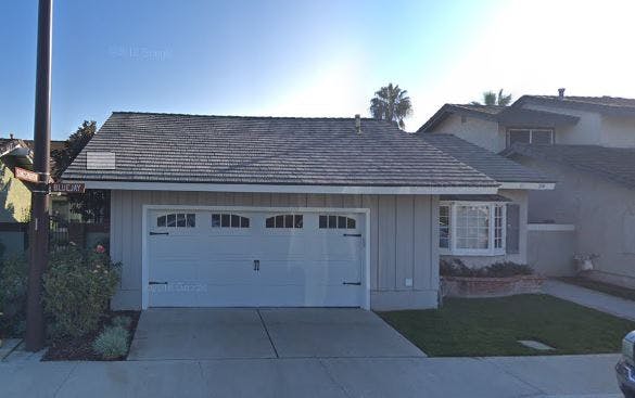 House with a two-car garage and a small front yard