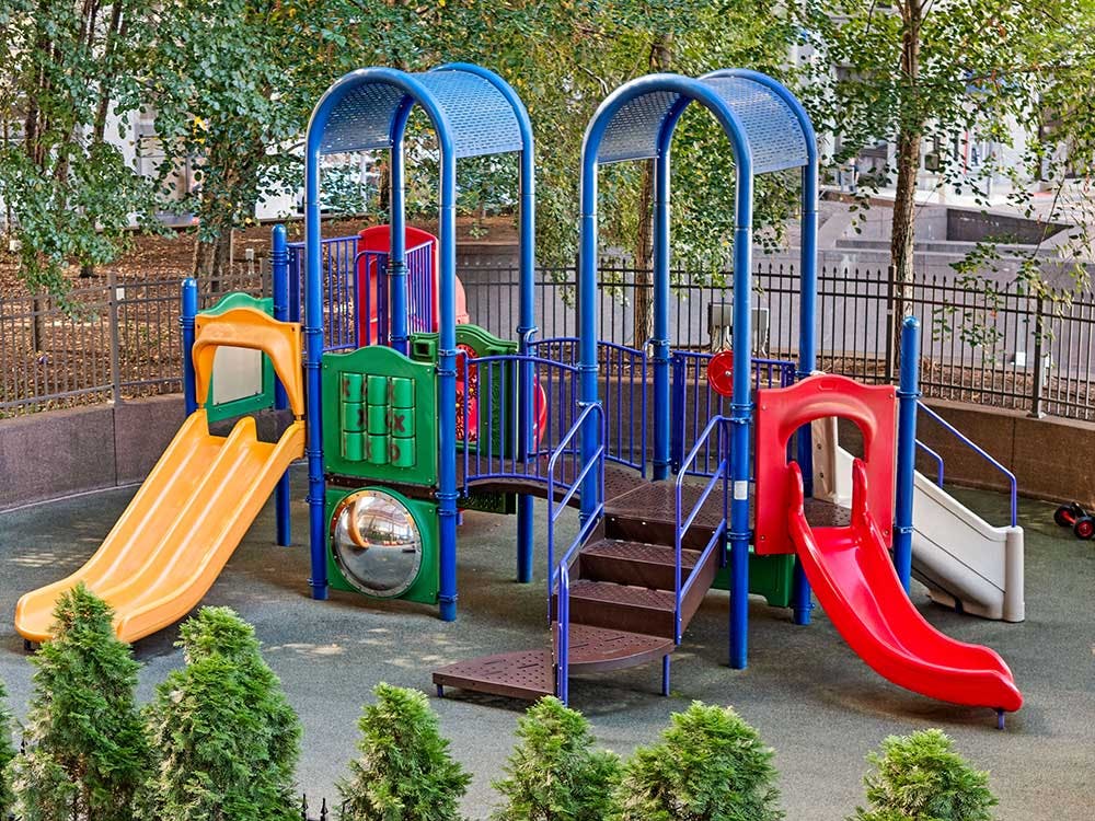 Colorful playground structure with multiple slides and climbing areas
