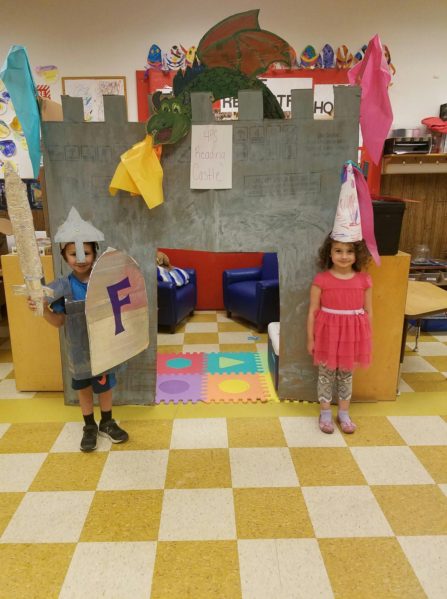 Child dressed as a knight with a sword and shield, child in a princess hat