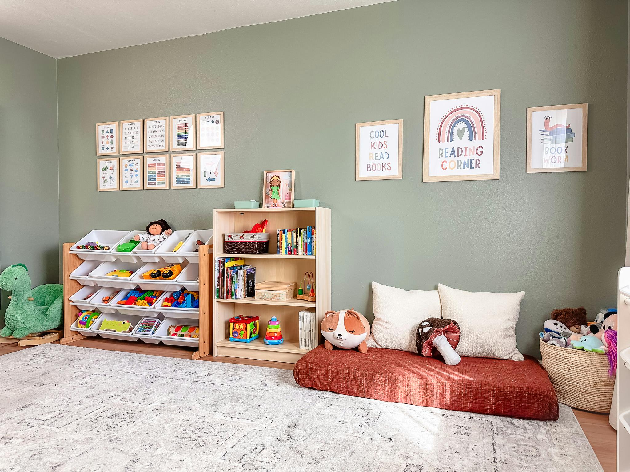 Children's room with toy storage, bookshelf, and floor cushion