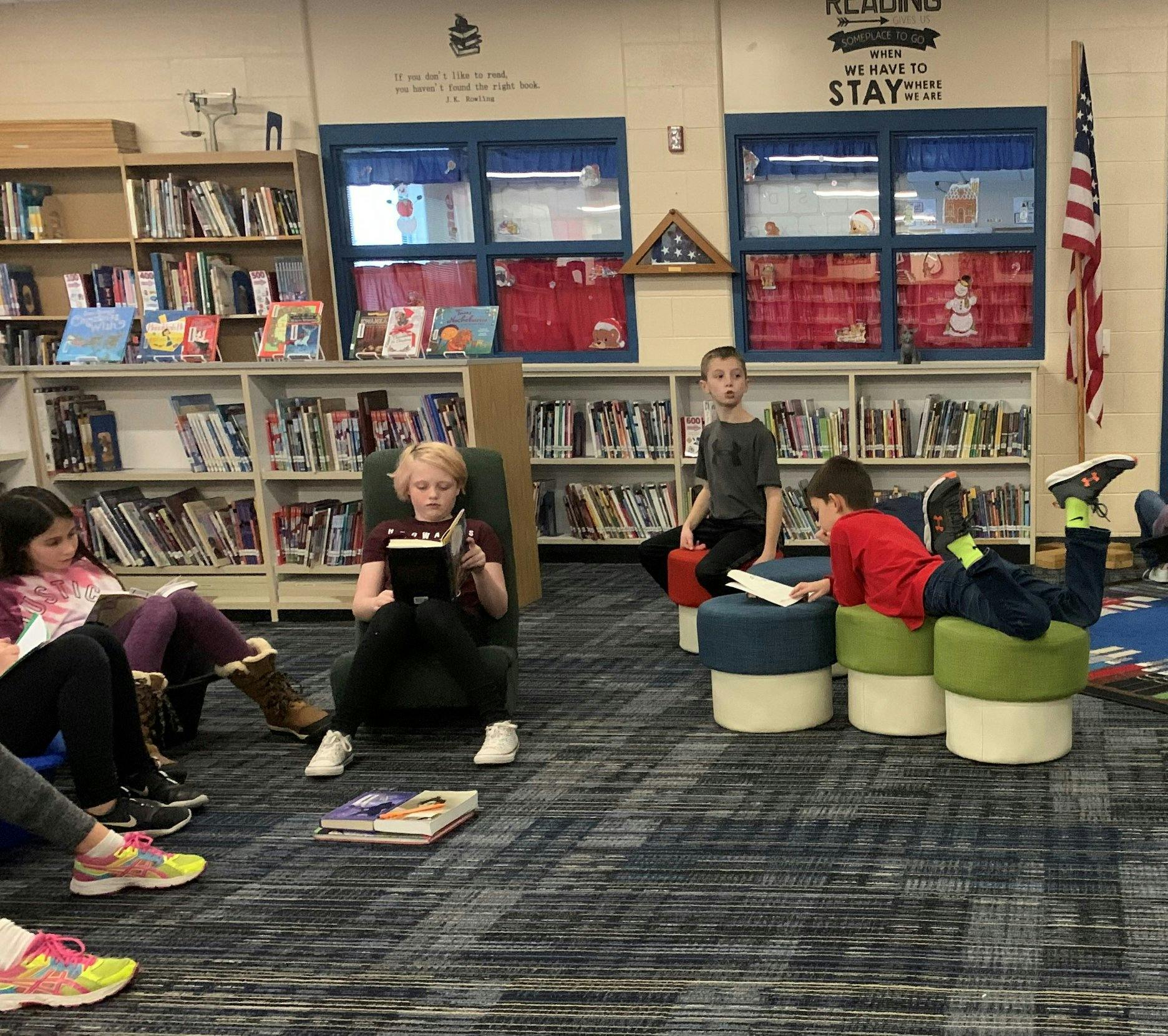 Children reading books in a library
