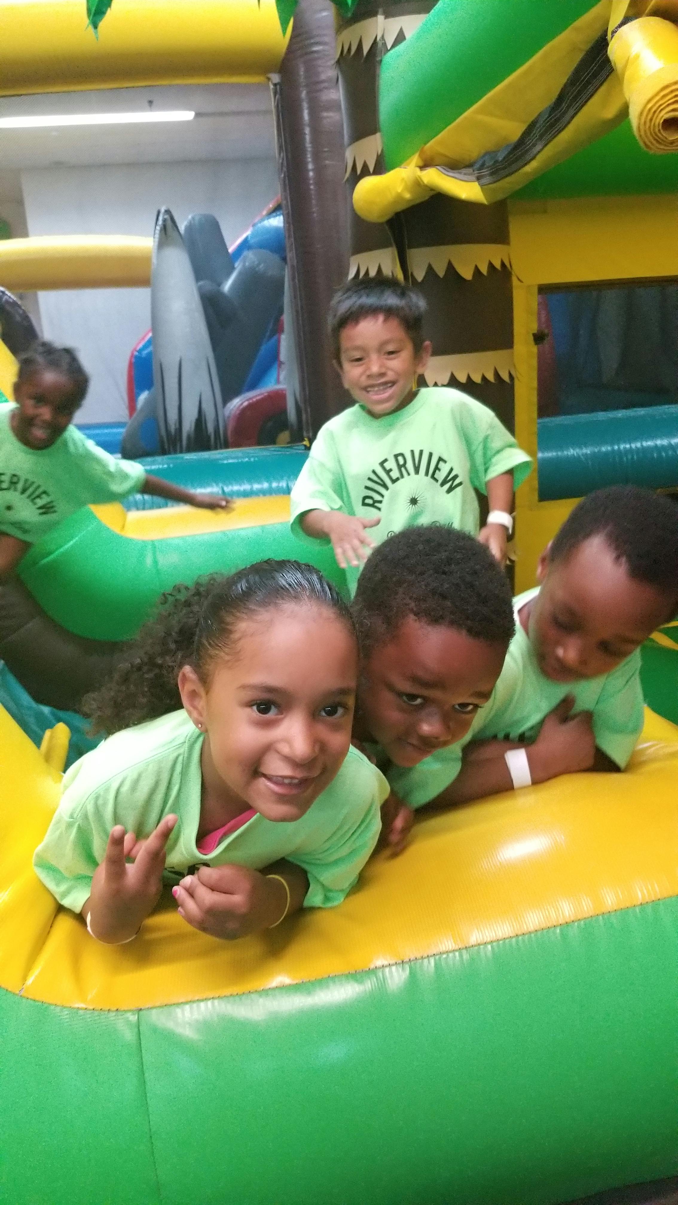 Children playing on an inflatable bounce house