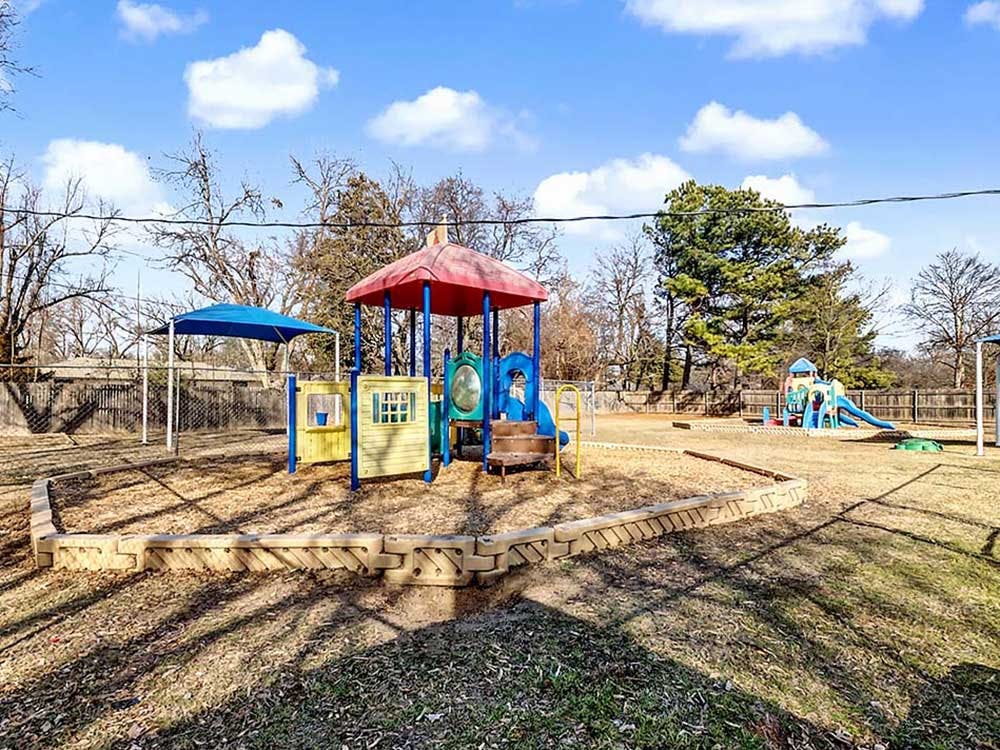 Colorful outdoor playground with play structures and slides