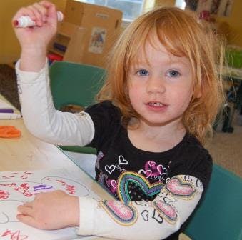 Child drawing with a marker