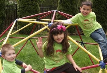 Three children on a jungle gym