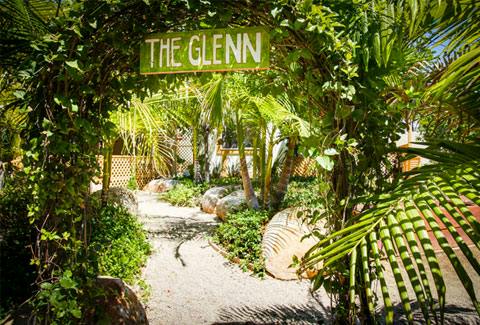 Path through lush greenery with a sign reading "THE GLENN"