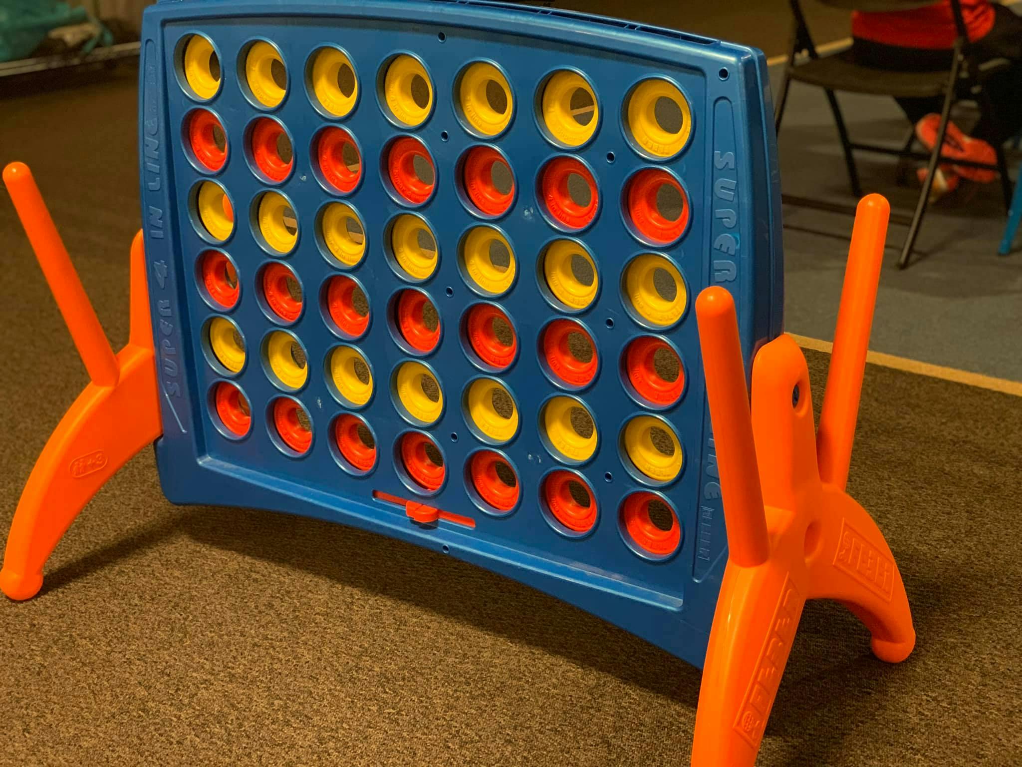 Blue Connect 4 game board with red and yellow discs