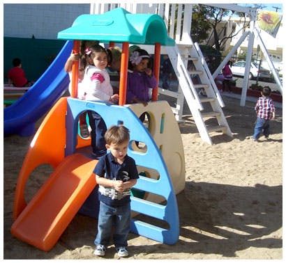 Children playing on a playground structure