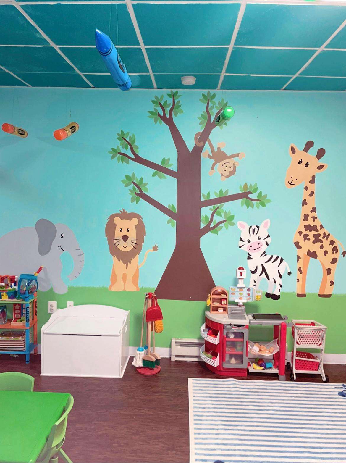 Playroom with animal wall decals and toys