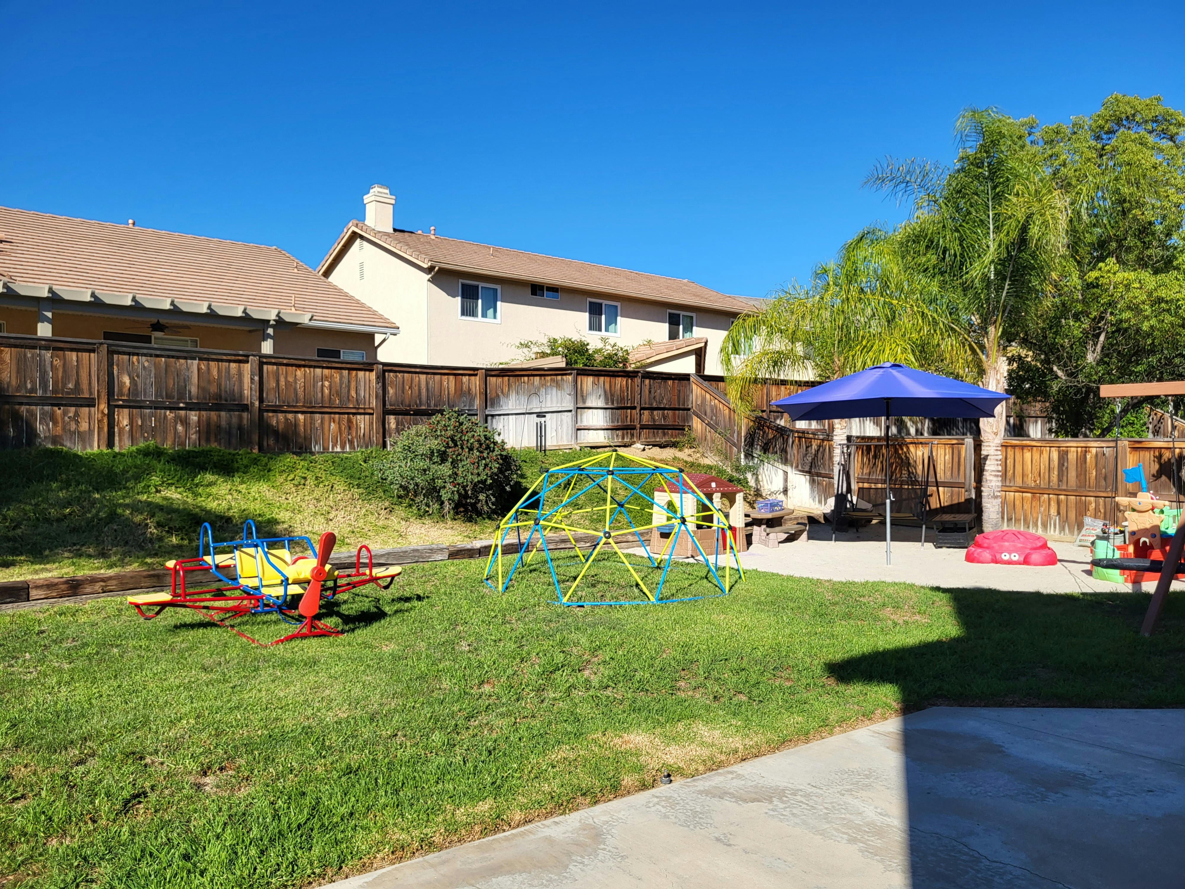 Playground with a geodesic dome climber and a seesaw