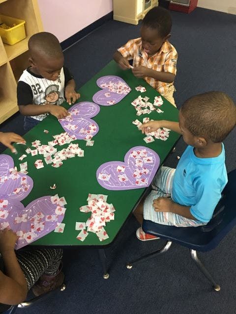 Children doing crafts at a table