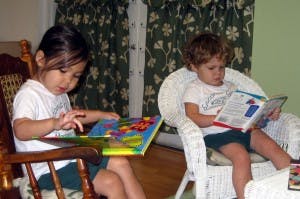 Two children reading books