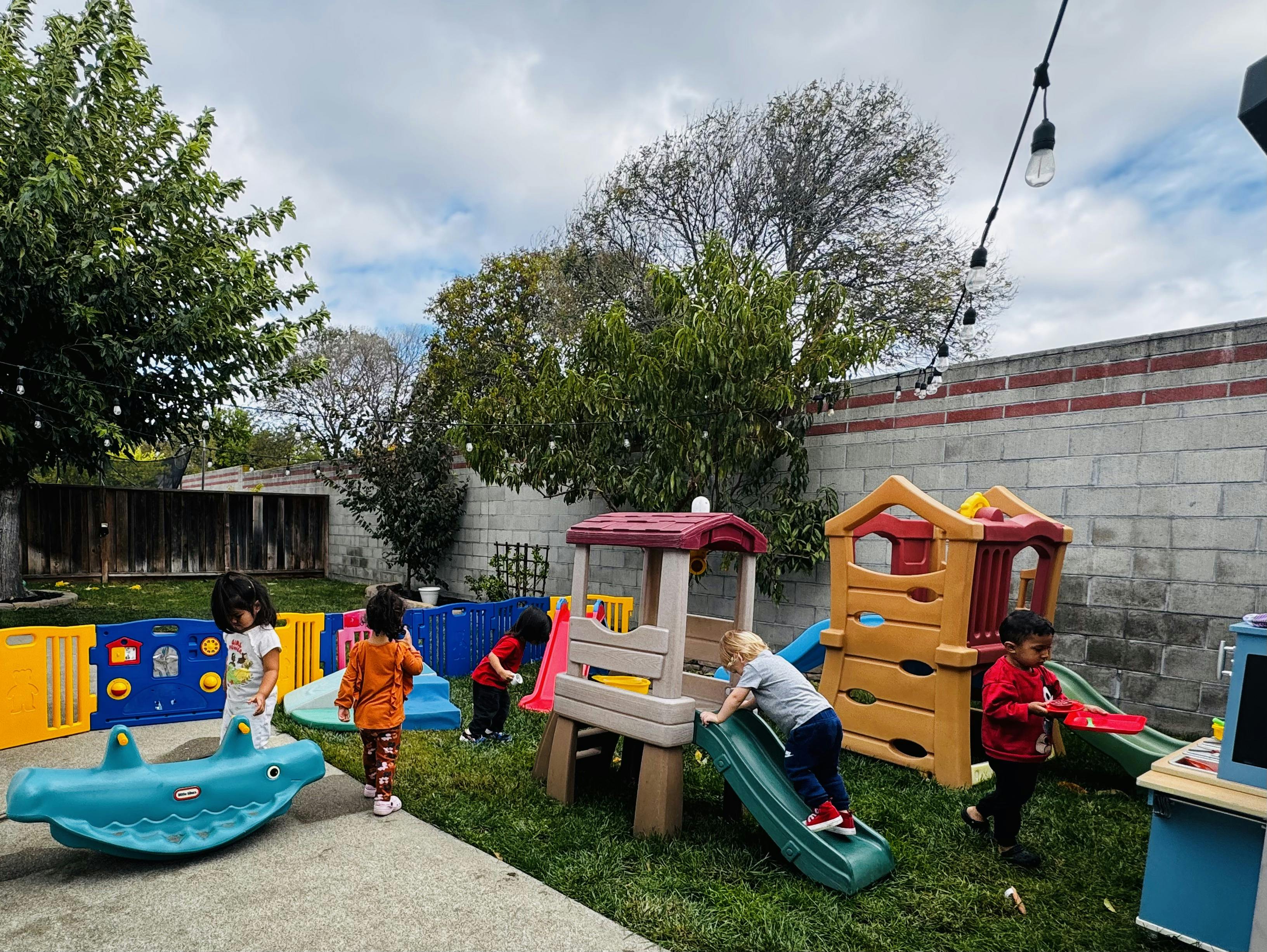 Children playing on outdoor playground equipment