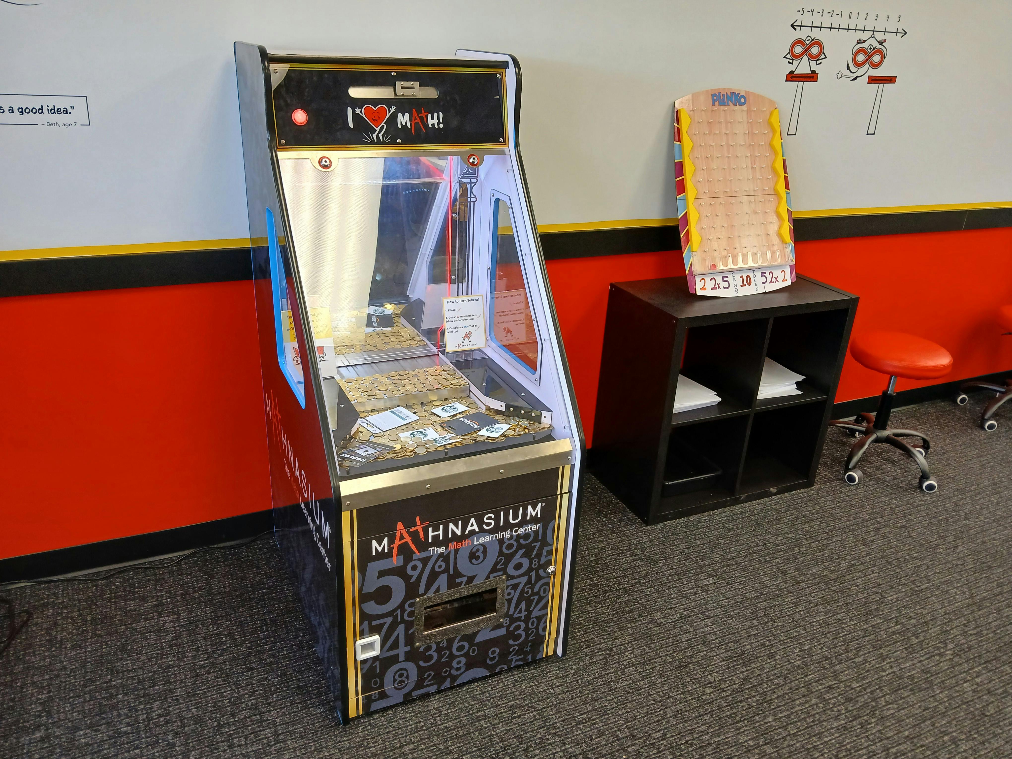 Claw machine with "Mathnasium" text