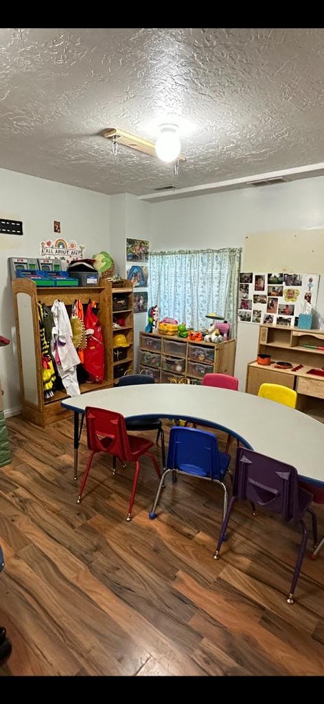 Classroom with a curved table and colorful chairs