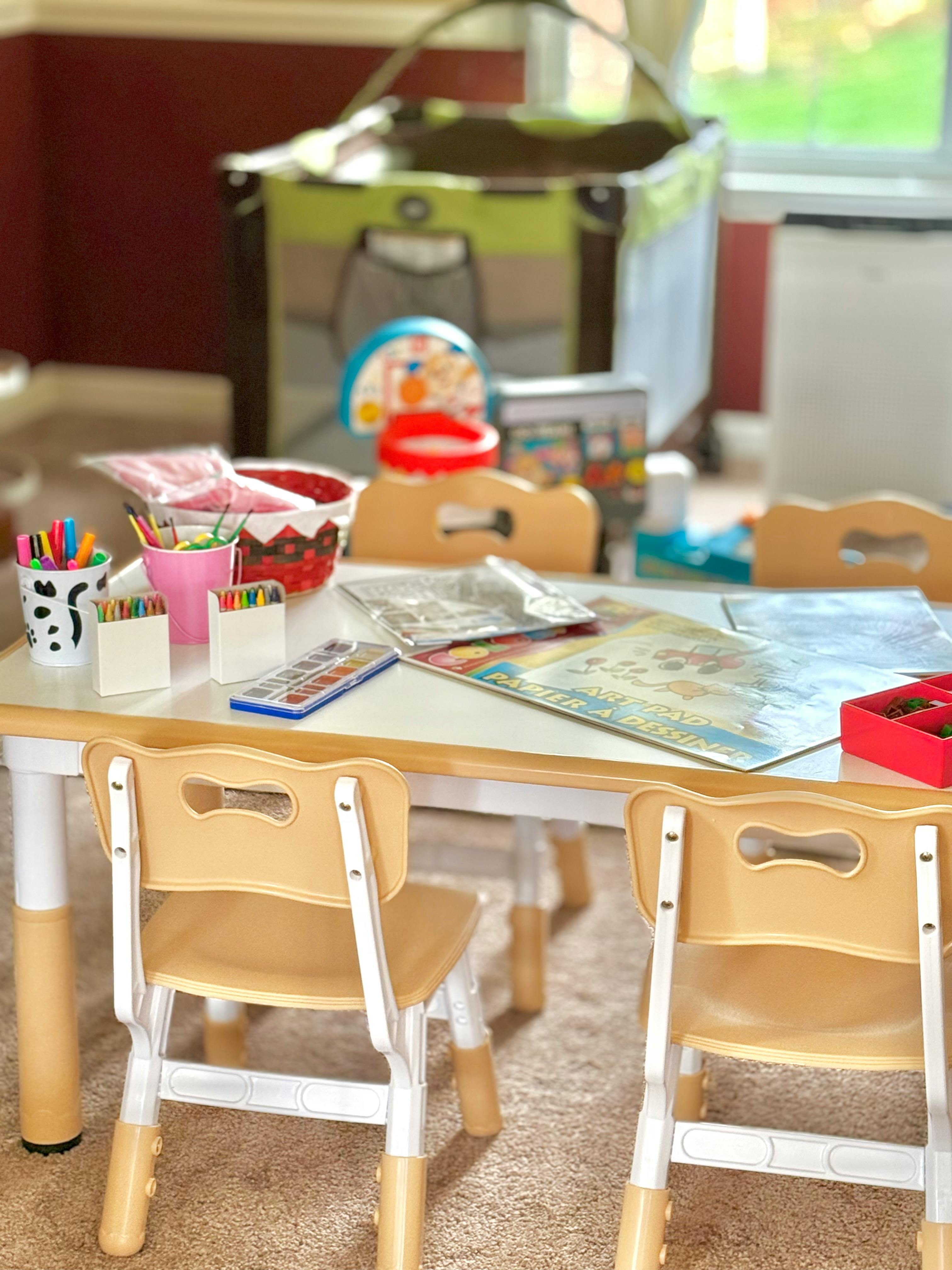 Children's table with art supplies and chairs