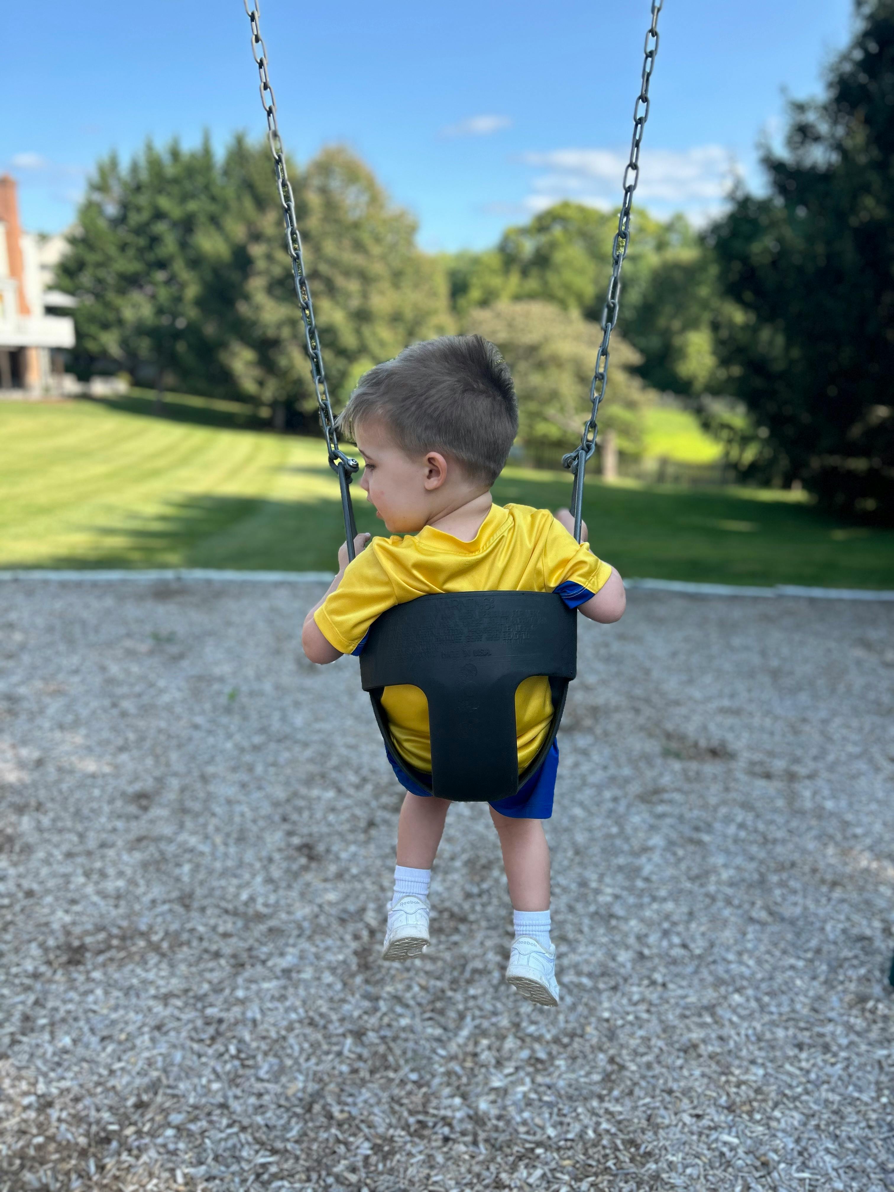Child in a swing at a playground