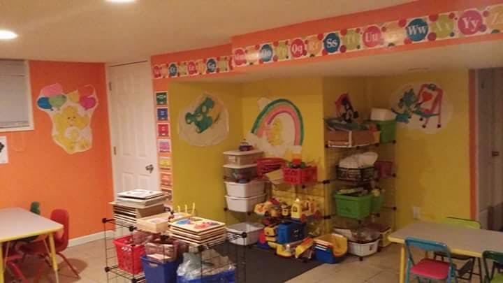 Playroom with colorful walls, tables, and toys