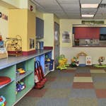 Playroom with shelves, toys, and a counter