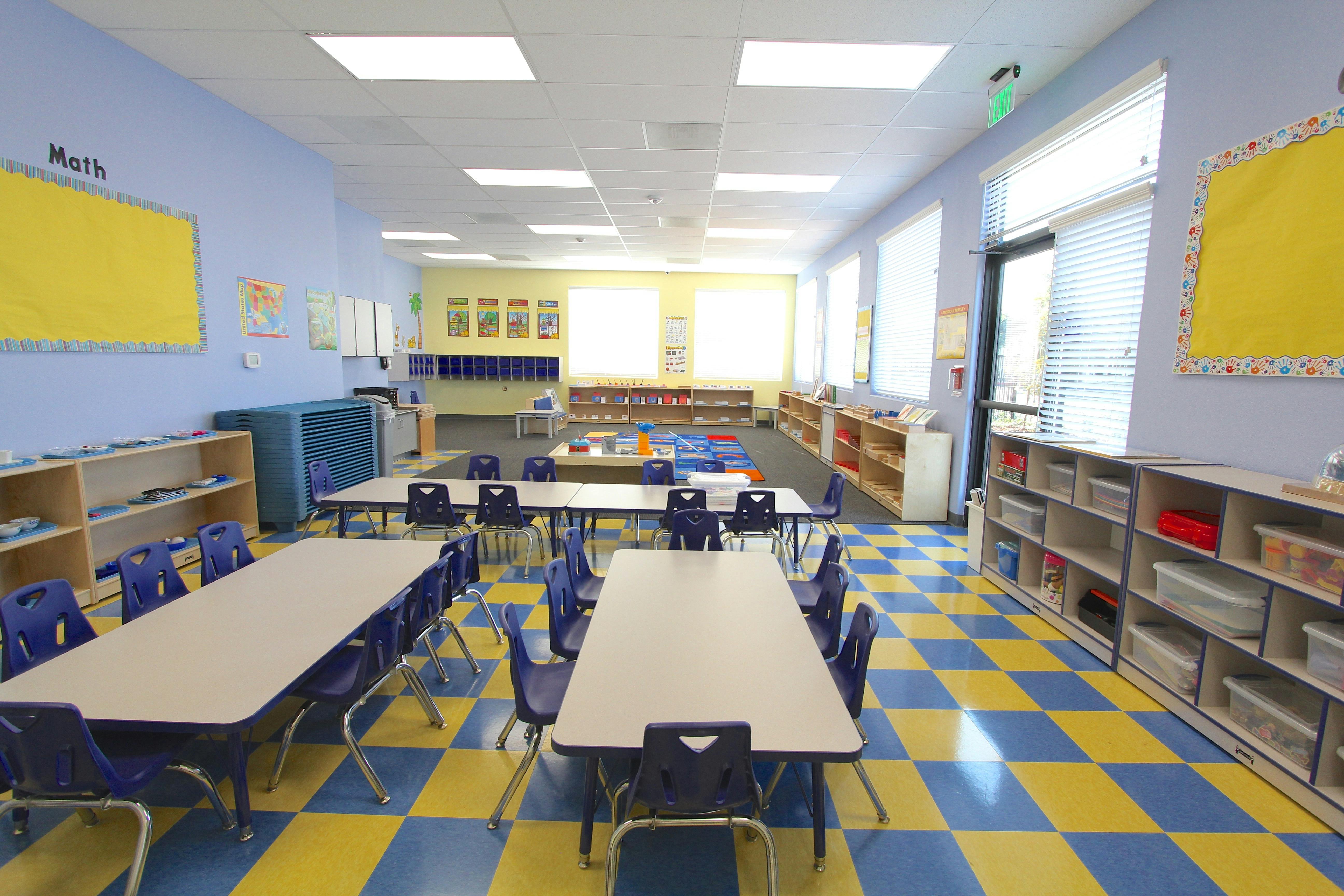 Empty classroom with tables and chairs