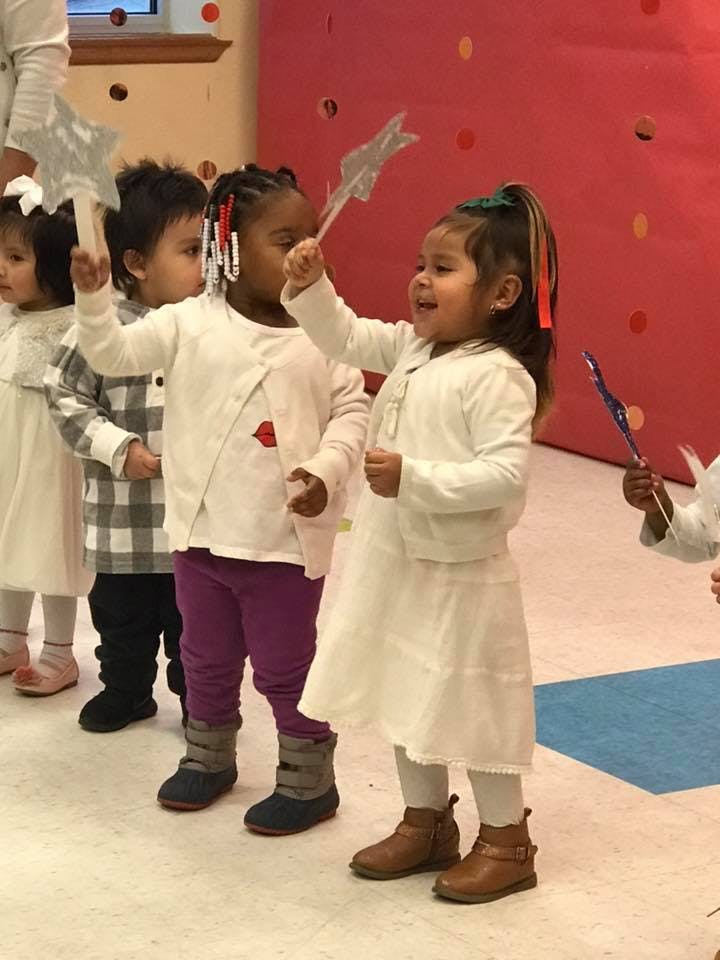 Children holding up star wands